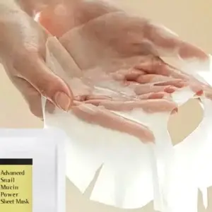 Woman hand holding Advanced Snail Mucin Power Sheet Mask moist sheet mask loaded snail mucin essence professional skincare treatment 96% snail secretion filtrate